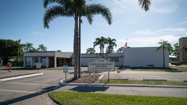 a view of a swimming pool with lounge chair