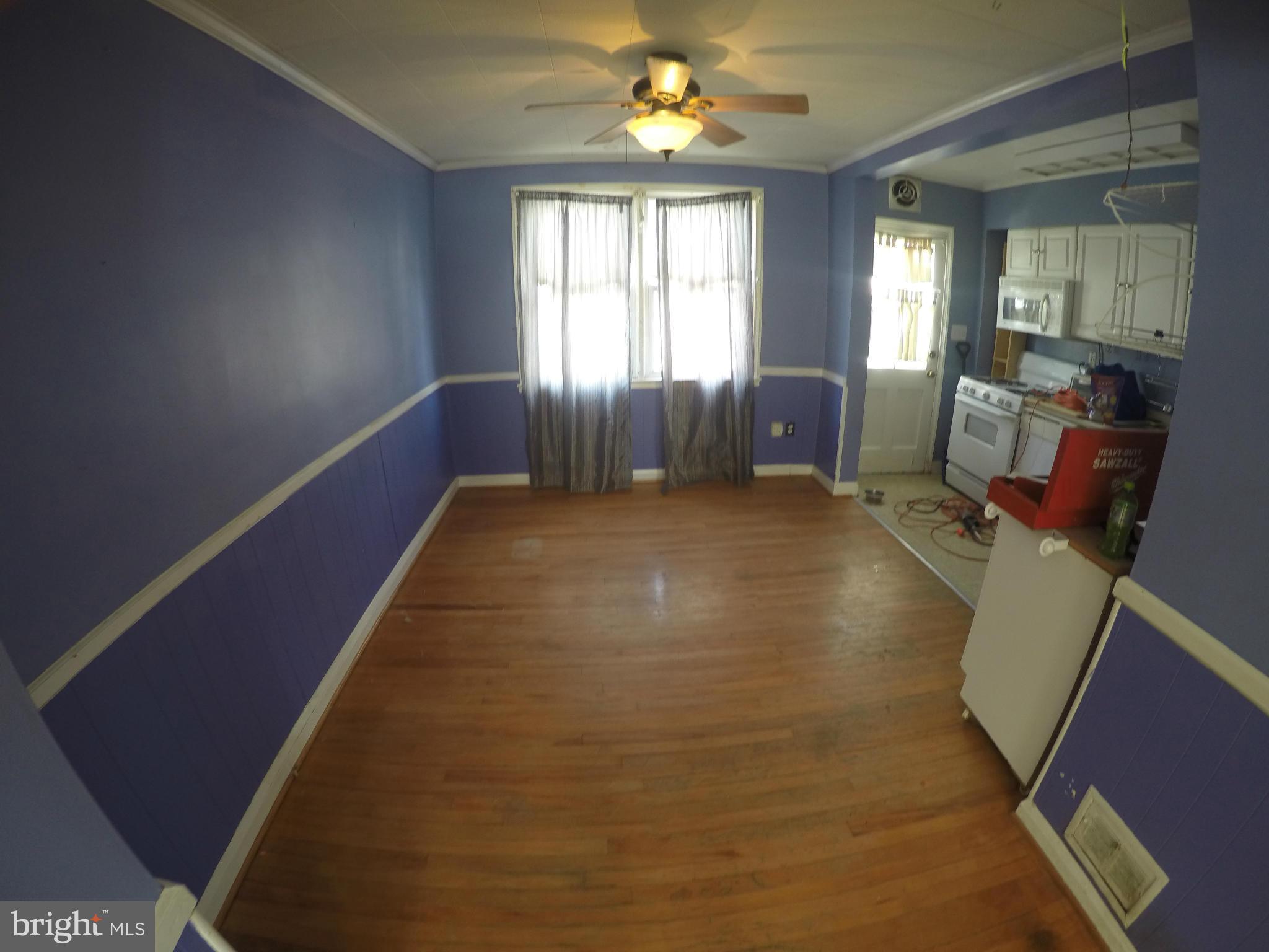8326 Edgedale Road Baltimore, MD 21234 - Photo 3 of 9 a furnished livingroom with windows