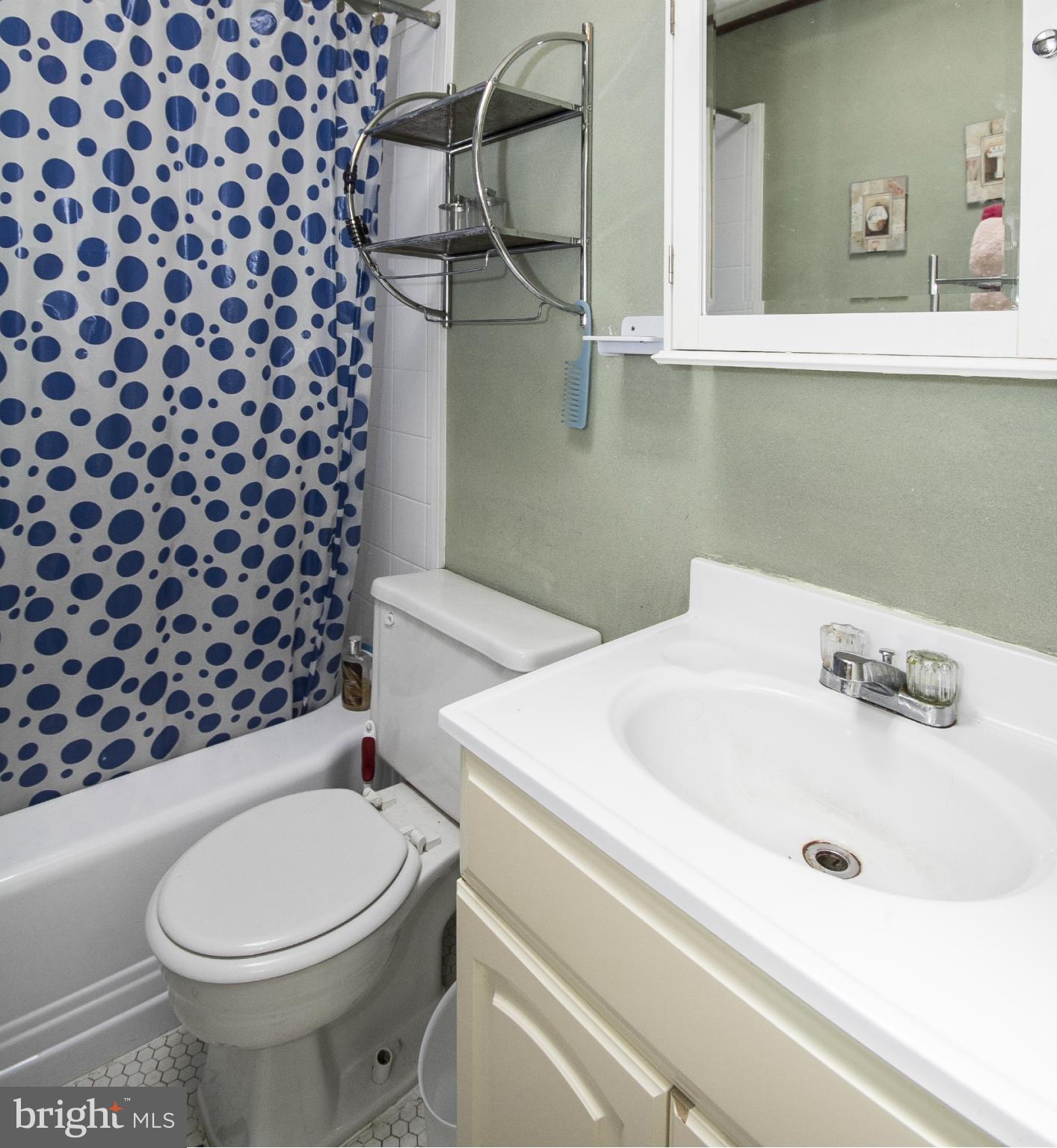 8326 Edgedale Road Baltimore, MD 21234 - Photo 5 of 9 a bathroom with a sink toilet and shower