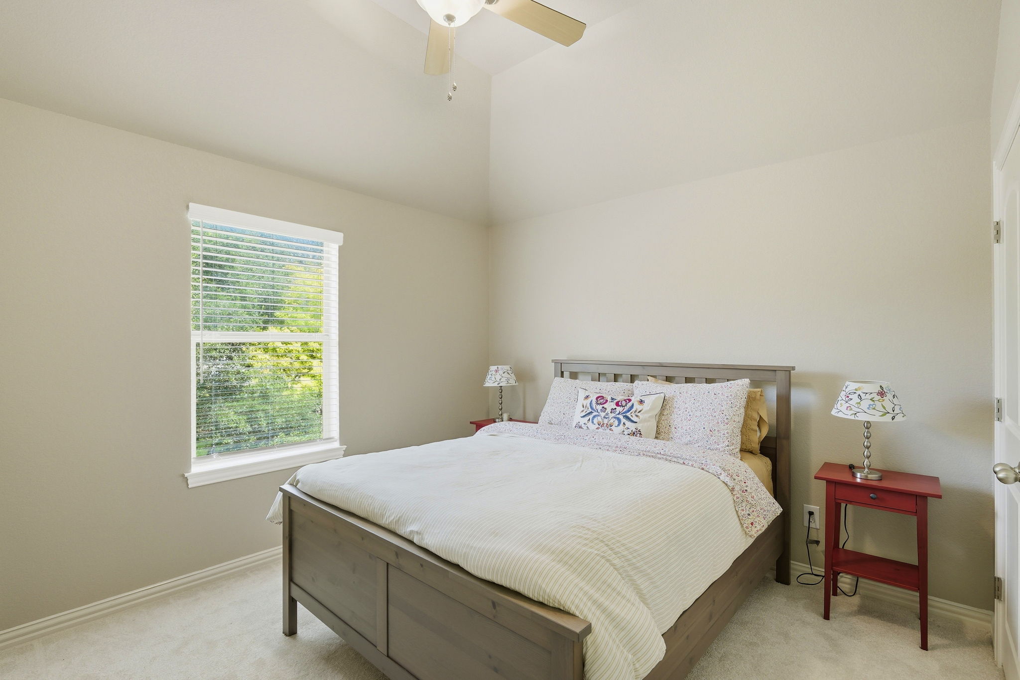 110 Dasher Drive Cedar Park, TX 78613 - Photo 23 of 39 Relaxing sleeping quarters with a vaulted ceiling and a serene outside view.