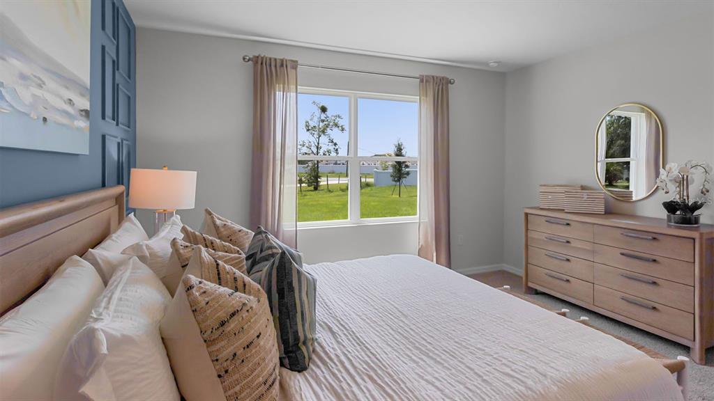 3316 White Indigo Road Winter Haven, FL 33884 - Photo 17 of 27 a bedroom with a bed and a dresser