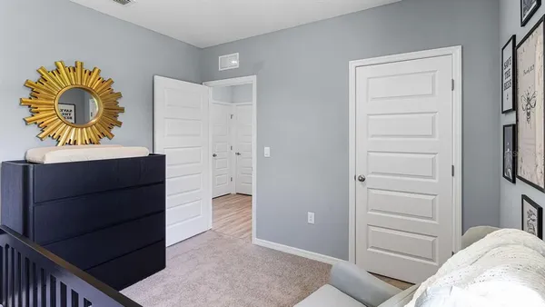 a bedroom with a bed and a cabinets