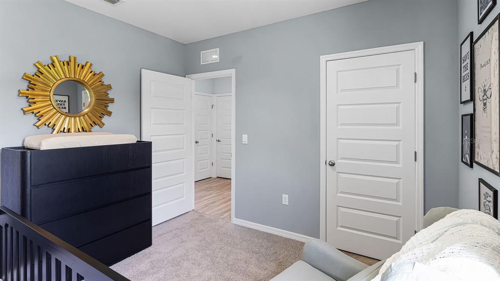 3316 White Indigo Road Winter Haven, FL 33884 - Photo 25 of 27 a bedroom with a bed and a cabinets