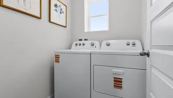 a utility room with dryer and washer