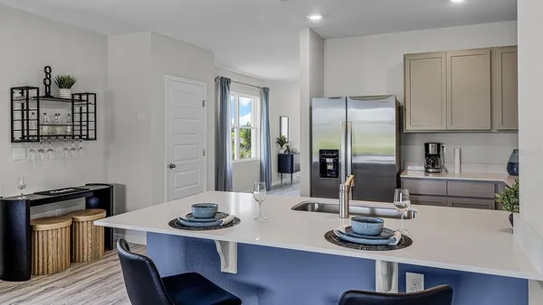a kitchen with a table and chairs in it
