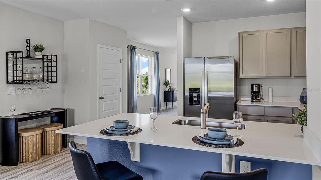 3316 White Indigo Road Winter Haven, FL 33884 - Photo 8 of 27 a kitchen with a table and chairs in it