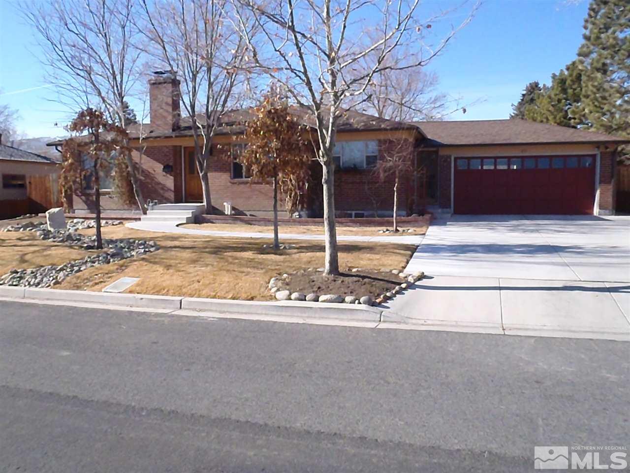 675 Robin Street Reno, NV 89509 - Photo 1 of 7 a view of a house with street