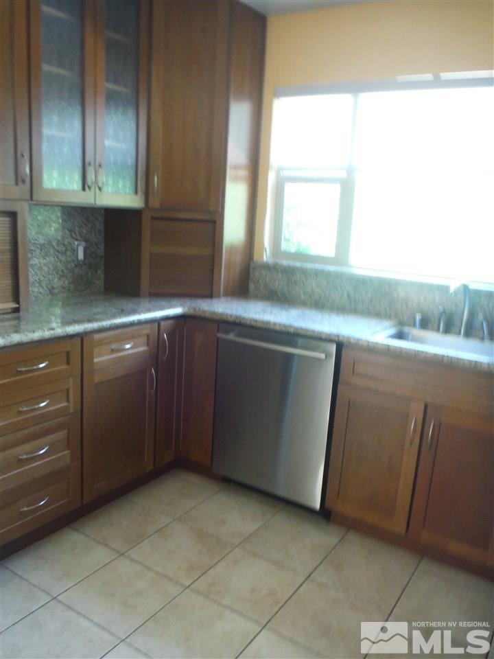 675 Robin Street Reno, NV 89509 - Photo 3 of 7 a kitchen with a sink and cabinets