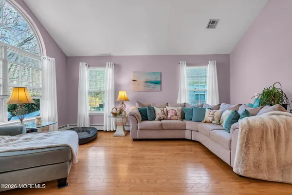 a living room with furniture and a large window