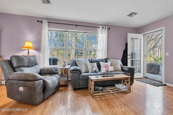 a living room with furniture and a large window
