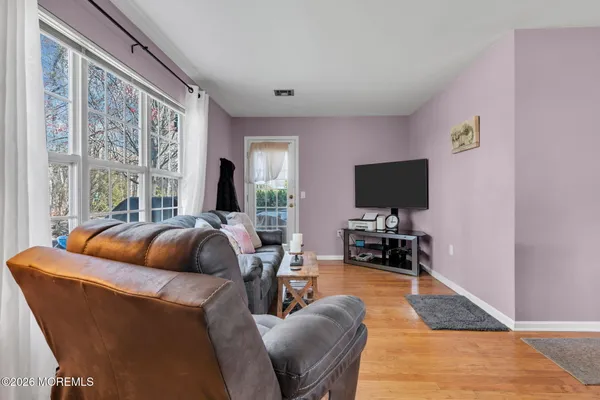 a living room with furniture fireplace and flat screen tv