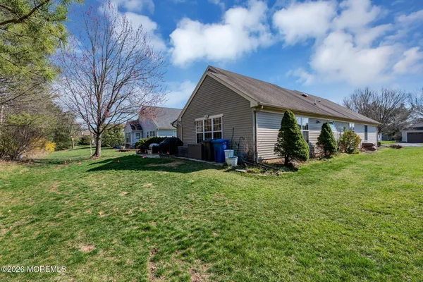 a view of house with yard