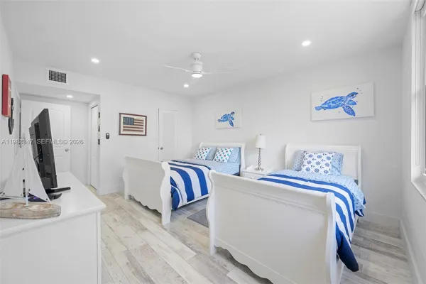 a view of living room with furniture and a flat screen tv