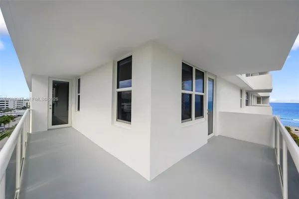 a view of hallway with kitchen