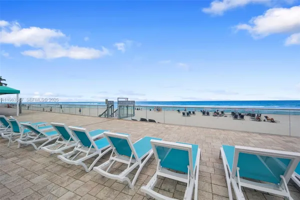 a view of a balcony with chairs