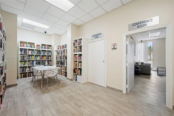 a view of a livingroom with furniture and wooden floor