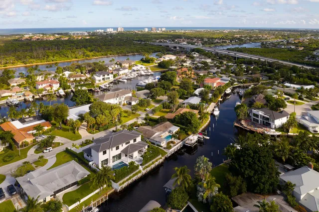 an aerial view of residential houses with outdoor space