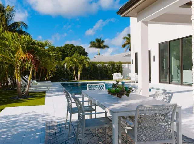 a view of swimming pool with seating space