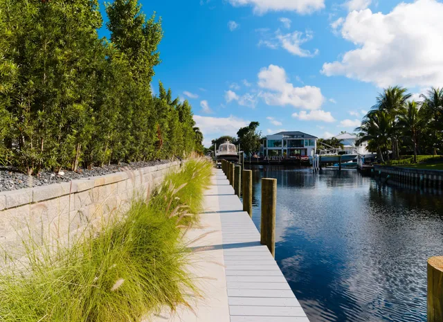 a lake view with boat and trees in the background