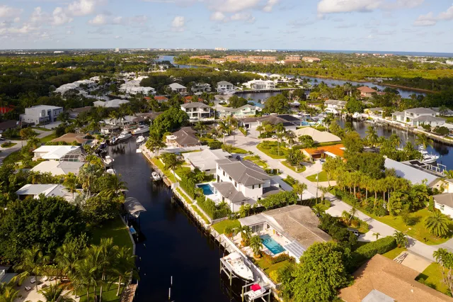 an aerial view of residential houses with outdoor space