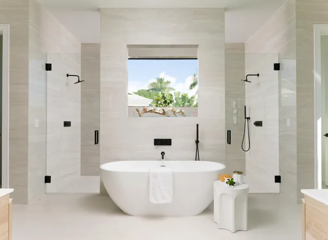 a white bath tub sitting in a bathroom