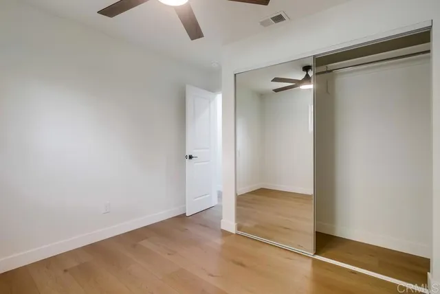 a bathroom with a sink vanity mirror and toilet