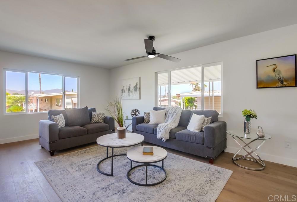 8301 Mission Gorge Road, Unit 331 Santee, CA 92071 - Photo 4 of 17 a living room with furniture a window and a table
