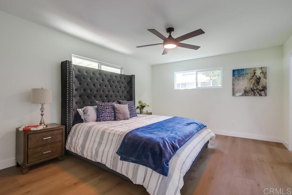 8301 Mission Gorge Road, Unit 331 Santee, CA 92071 - Photo 9 of 17 a bedroom with a bed and wooden floor