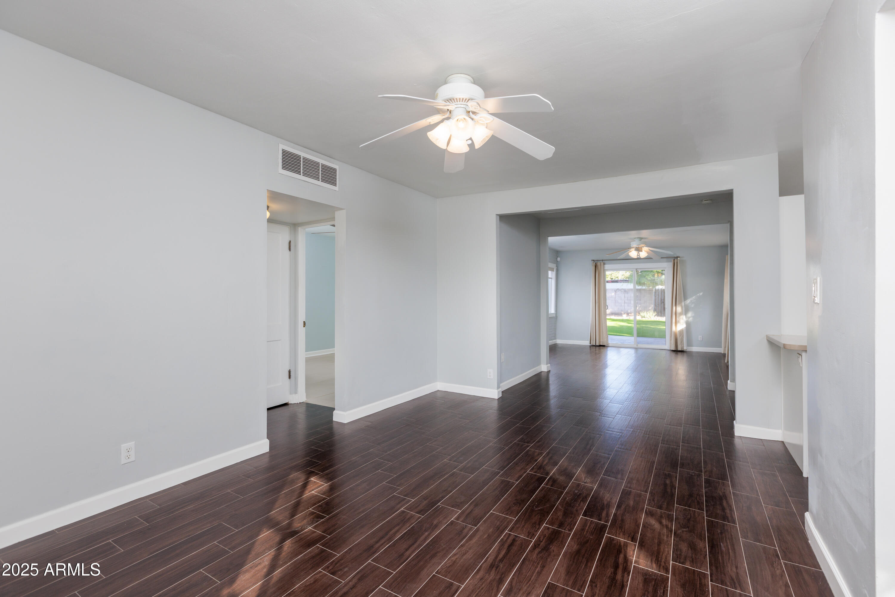 1621 North 16th Avenue Phoenix, AZ 85007 - Photo 11 of 32 a view of livingroom with hardwood floor and ceiling fan