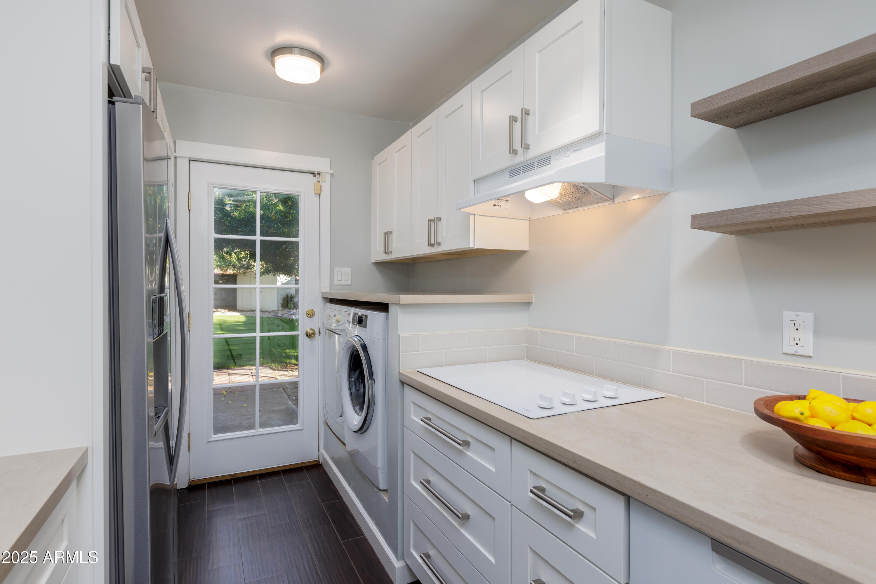 1621 North 16th Avenue Phoenix, AZ 85007 - Photo 13 of 32 a kitchen with a sink a stove and cabinets