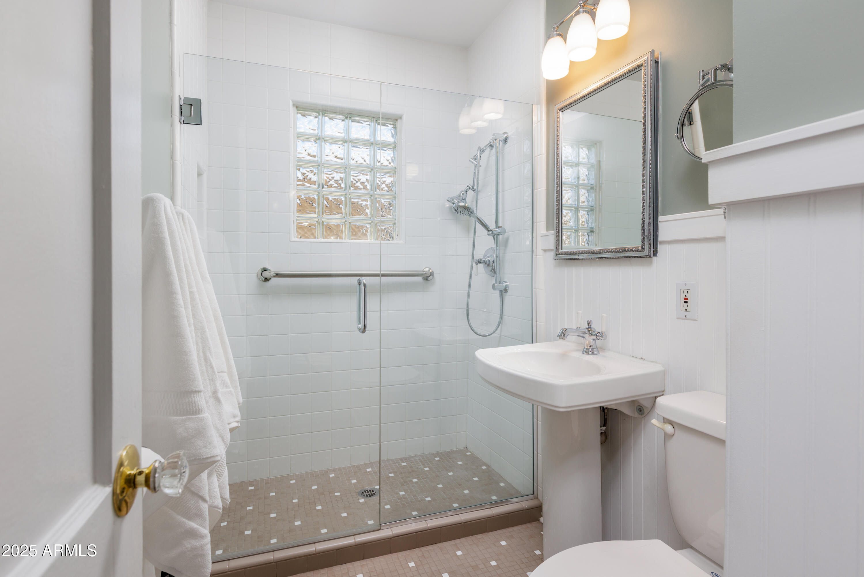 1621 North 16th Avenue Phoenix, AZ 85007 - Photo 24 of 32 a bathroom with a sink mirror toilet and shower