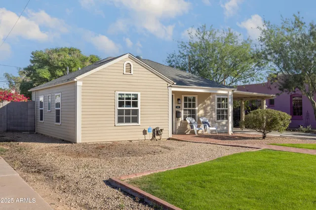 a front view of a house with a yard
