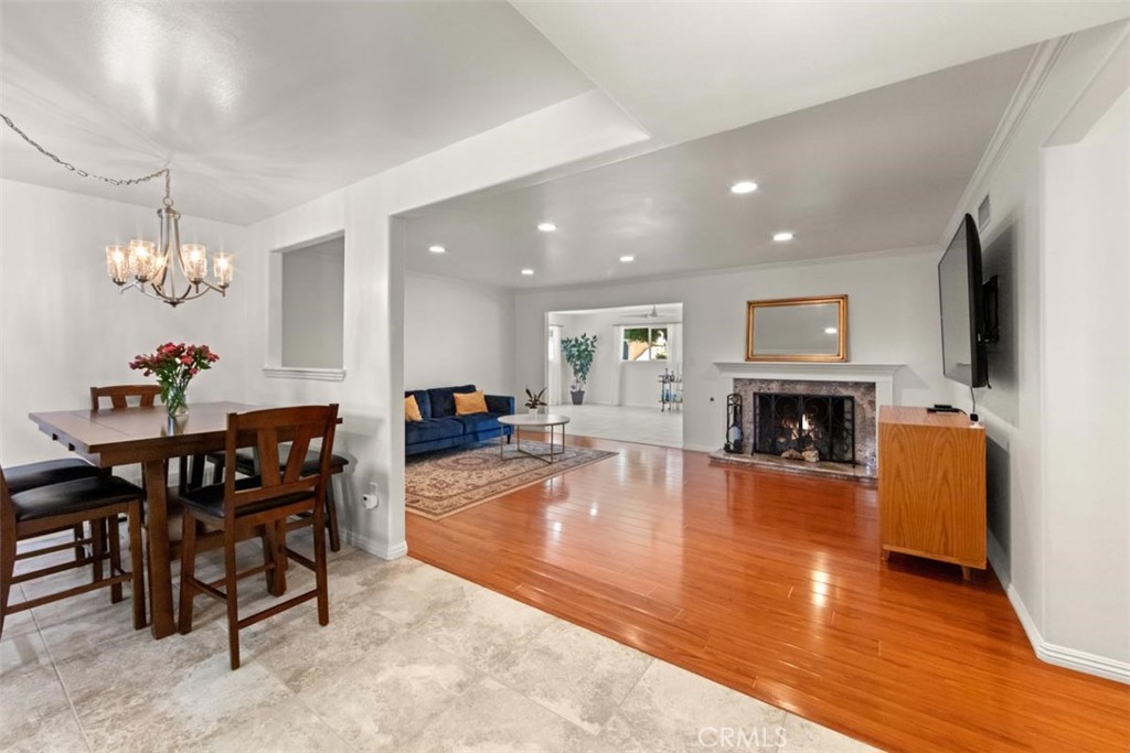 3275 Dalhart Avenue Simi Valley, CA 93063 - Photo 13 of 41 a living room with furniture a fireplace and a flat screen tv
