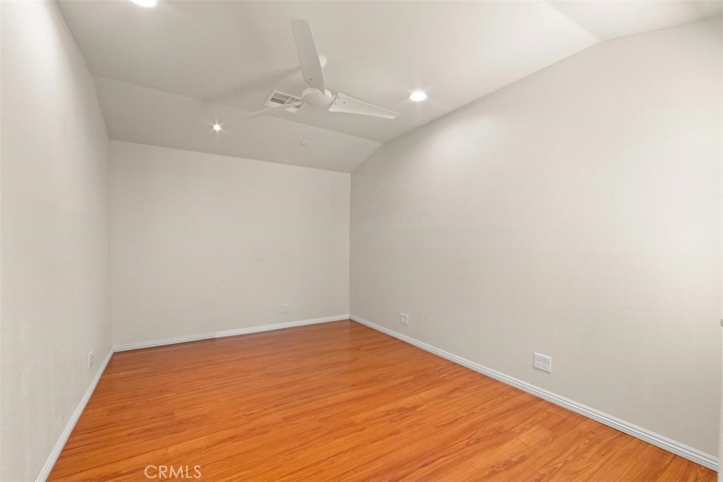 3275 Dalhart Avenue Simi Valley, CA 93063 - Photo 14 of 41 an empty room with wooden floor and fan