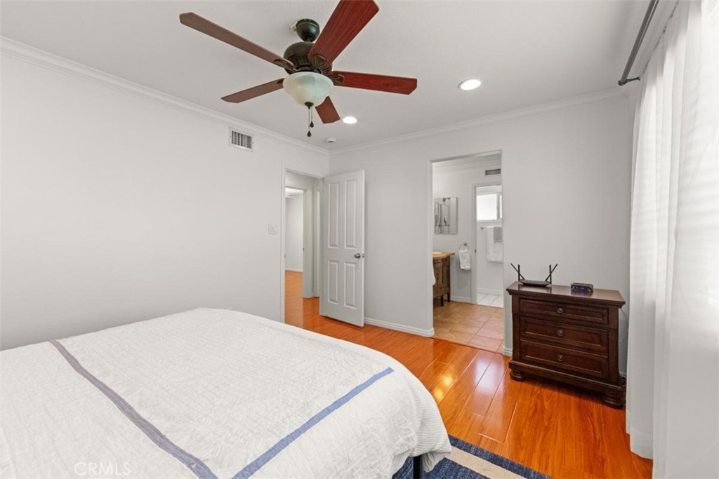 3275 Dalhart Avenue Simi Valley, CA 93063 - Photo 17 of 41 a bedroom with a bed and dresser with wooden floor