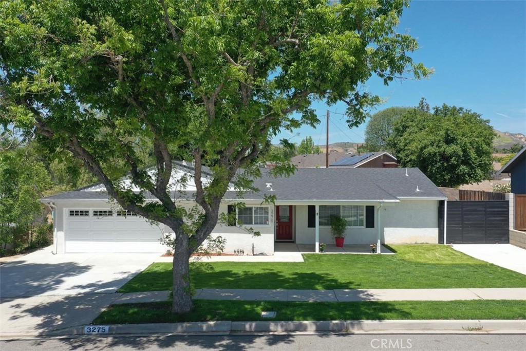 3275 Dalhart Avenue Simi Valley, CA 93063 - Photo 2 of 41 a front view of a house with a yard