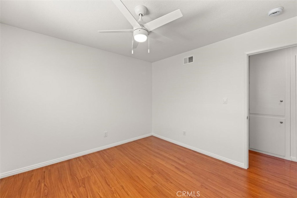 3275 Dalhart Avenue Simi Valley, CA 93063 - Photo 21 of 41 an empty room with wooden floor and fan