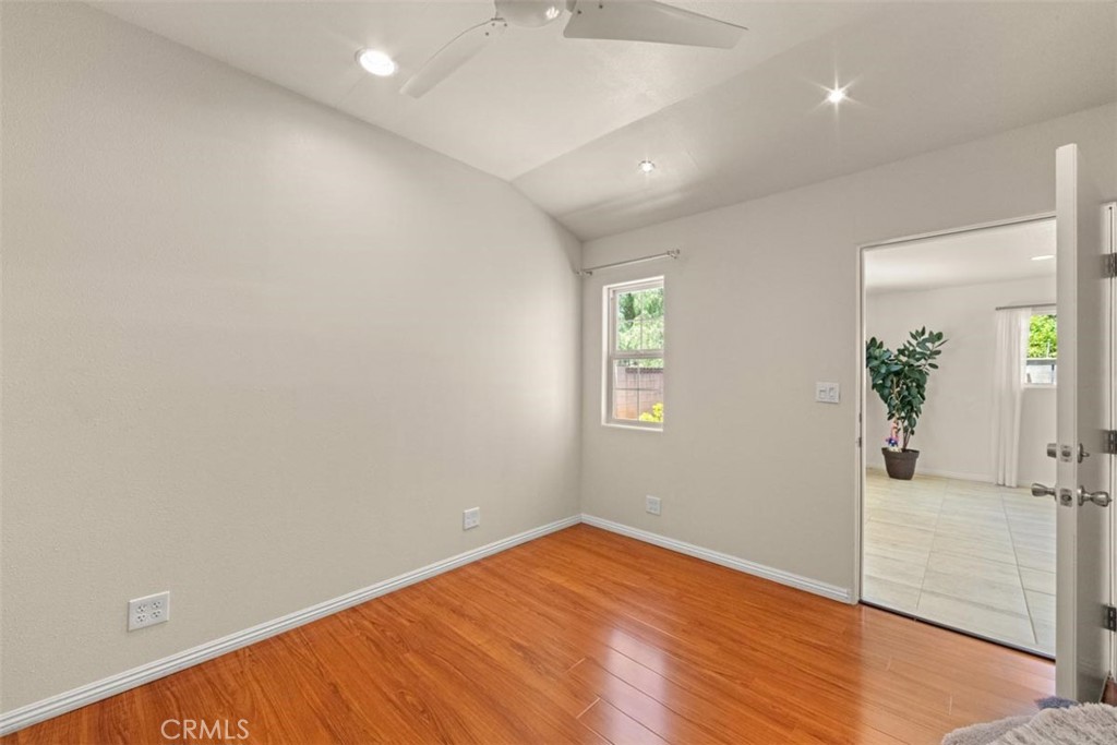 3275 Dalhart Avenue Simi Valley, CA 93063 - Photo 22 of 41 an empty room with window and wooden floor