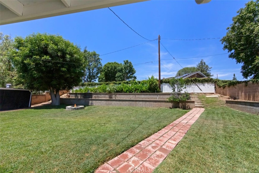 3275 Dalhart Avenue Simi Valley, CA 93063 - Photo 26 of 41 a view of a garden with a slide