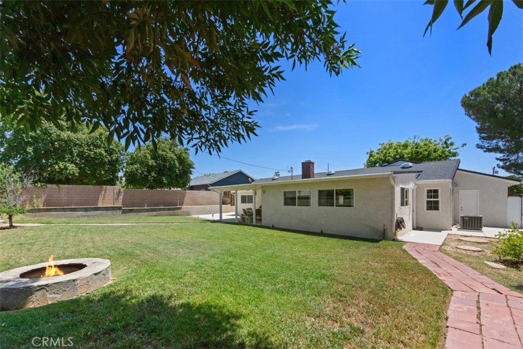 3275 Dalhart Avenue Simi Valley, CA 93063 - Photo 27 of 41 a house with swimming pool in front of it