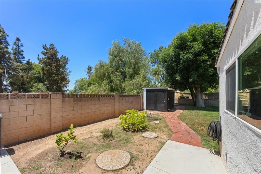 3275 Dalhart Avenue Simi Valley, CA 93063 - Photo 34 of 41 a view of a backyard with furniture and outdoor kitchen