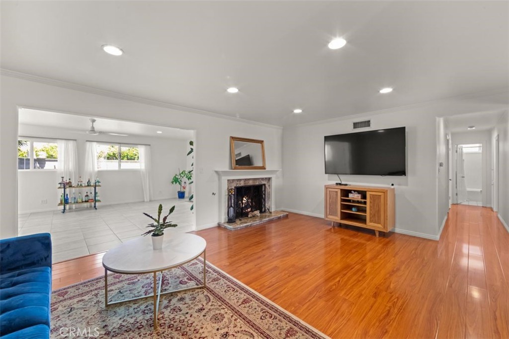 3275 Dalhart Avenue Simi Valley, CA 93063 - Photo 6 of 41 a living room with furniture flat screen tv and a fireplace