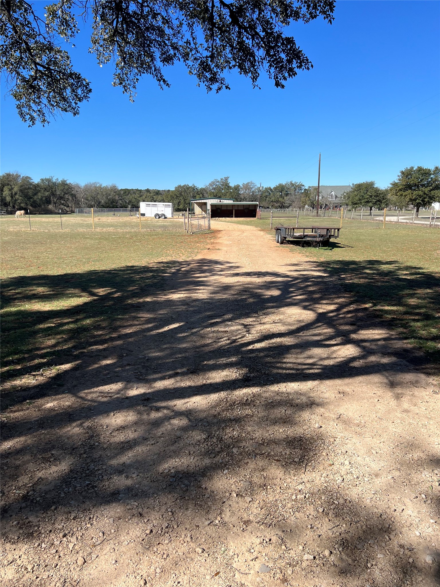 555 River Run Leander, TX 78641 - Photo 2 of 32 All-weather driveway from front gate