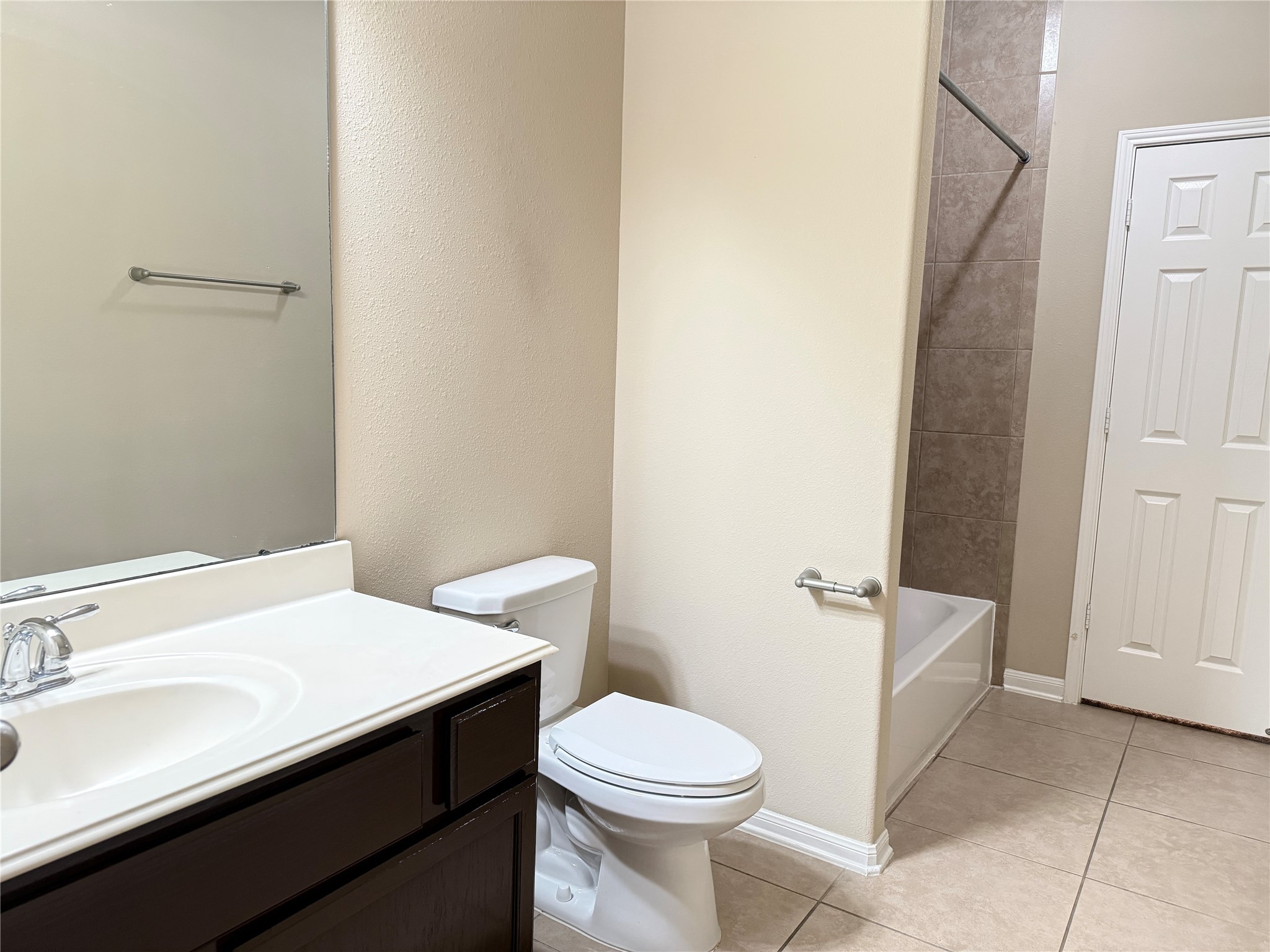21907 Cascade Hollow Lane Spring, TX 77379 - Photo 34 of 40 a bathroom with a sink a toilet and shower