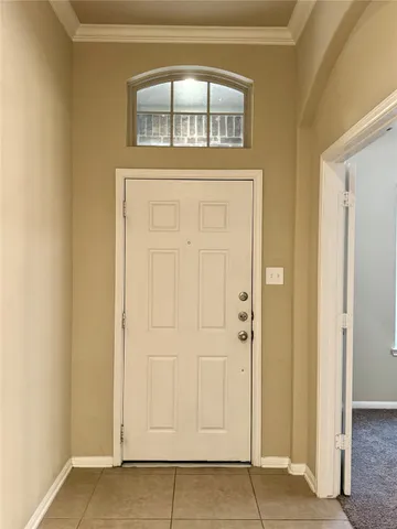 an empty room with wooden door