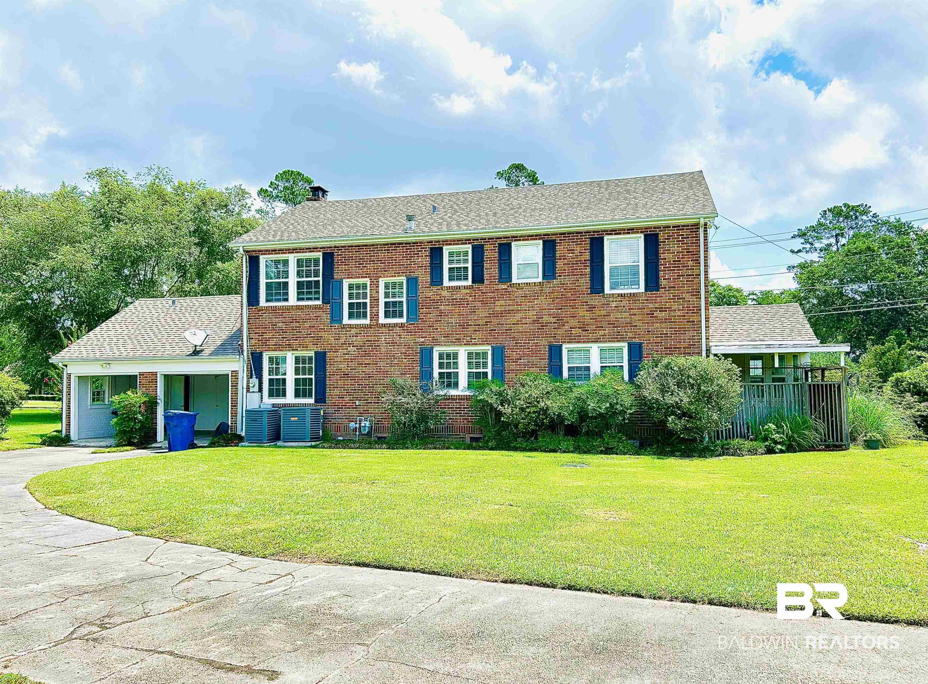 1405 Escambia Avenue Brewton, AL 36426 - Photo 16 of 16 Colonial house featuring a front yard and brick siding