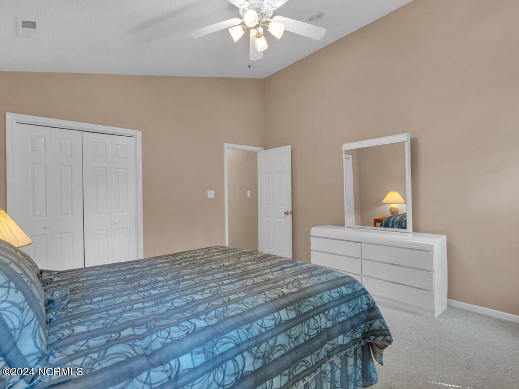 417 Deer Path Calabash, NC 28467 - Photo 13 of 32 This guest bedroom will allow your loved ones to save money and let you enjoy more quality time with them.