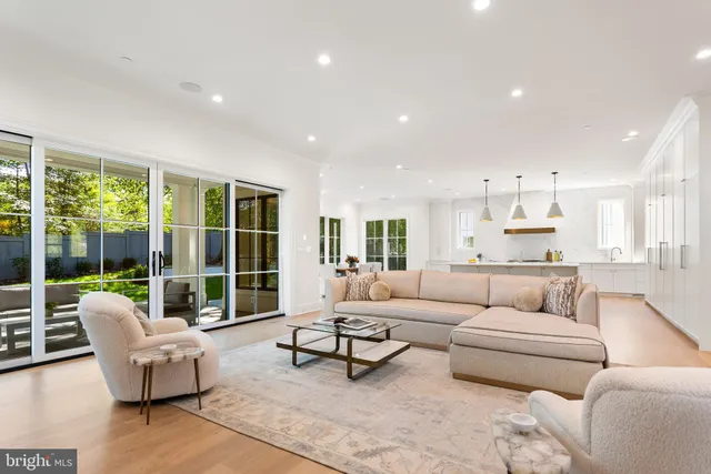 a living room with furniture a window and a fireplace