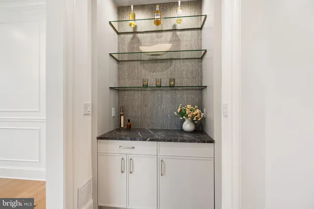 a bathroom with a sink toilet and mirror