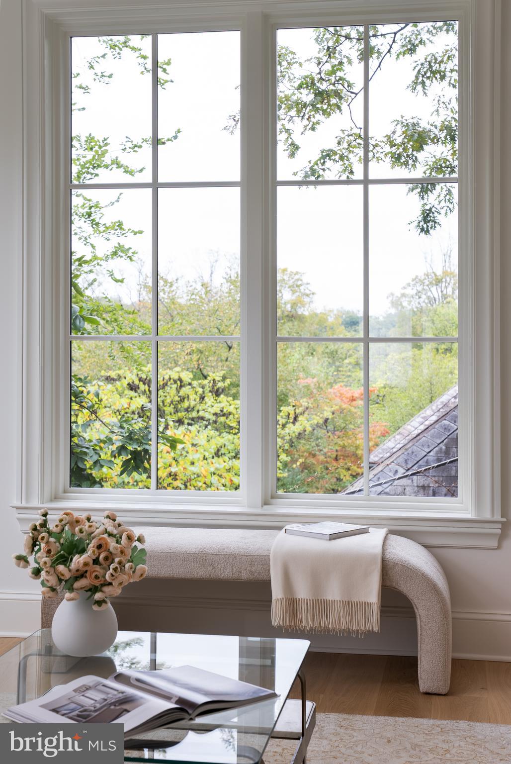 2916 Chesapeake Street Northwest Washington, DC 20008 - Photo 19 of 54 a living room with a large window and floor to ceiling windows
